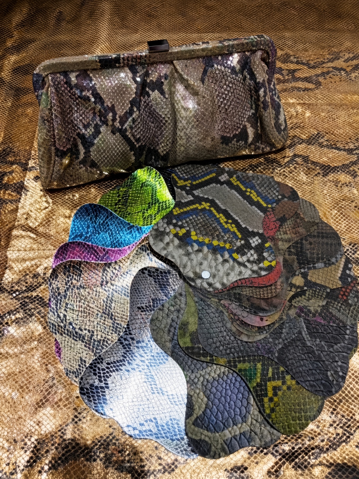 Snake-print clutch with print skins